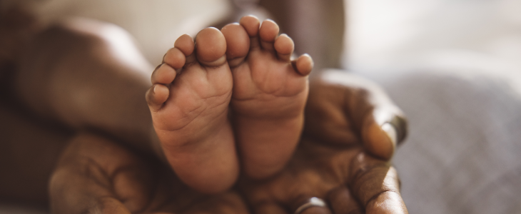 Mother holding her baby's feet in Washington, D.C.