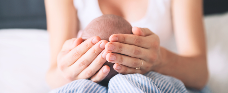 Mom holding her baby after a birth injury