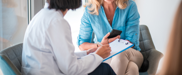 Doctor speaking with a client about diagnosis